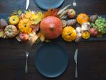 Pumpkin And Squash Centerpiece On Dinner Table